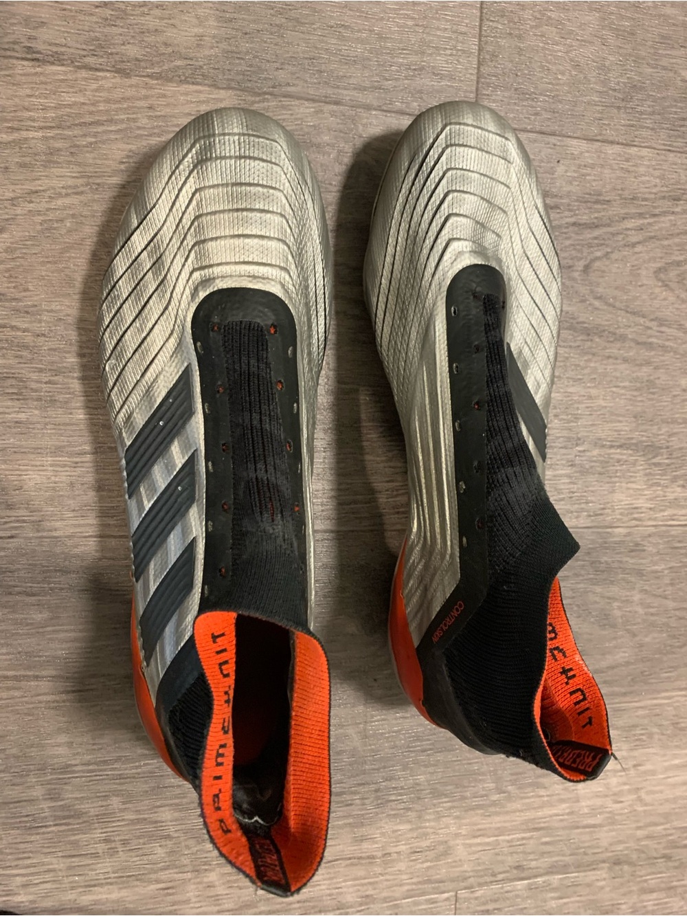 Soccer Cleats in Silver and Bright Orange